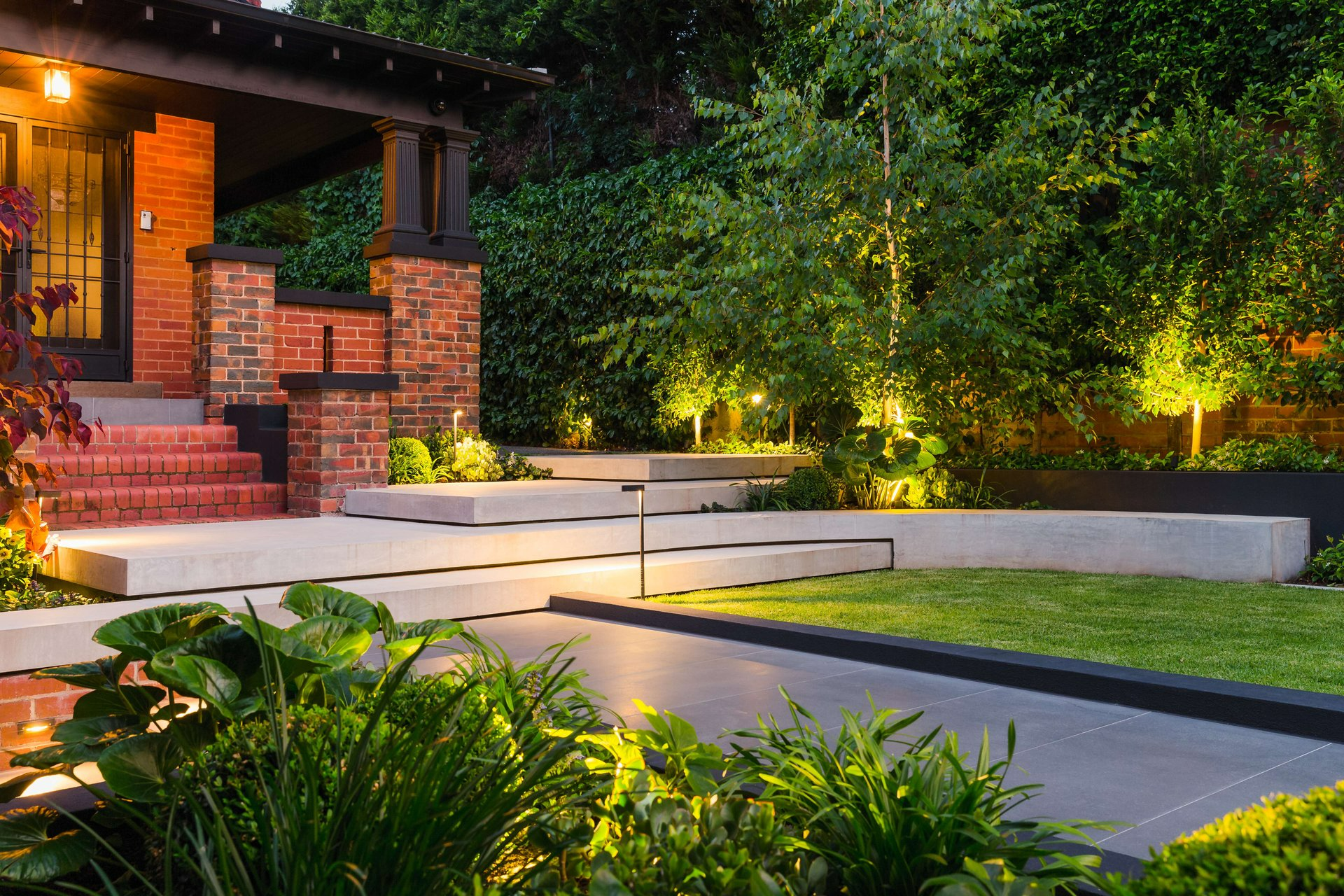 Coastal Court Flinders by Bower Architecture & Interiors. Photography by Shannon McGrath. Woman standing in her native garden.  
