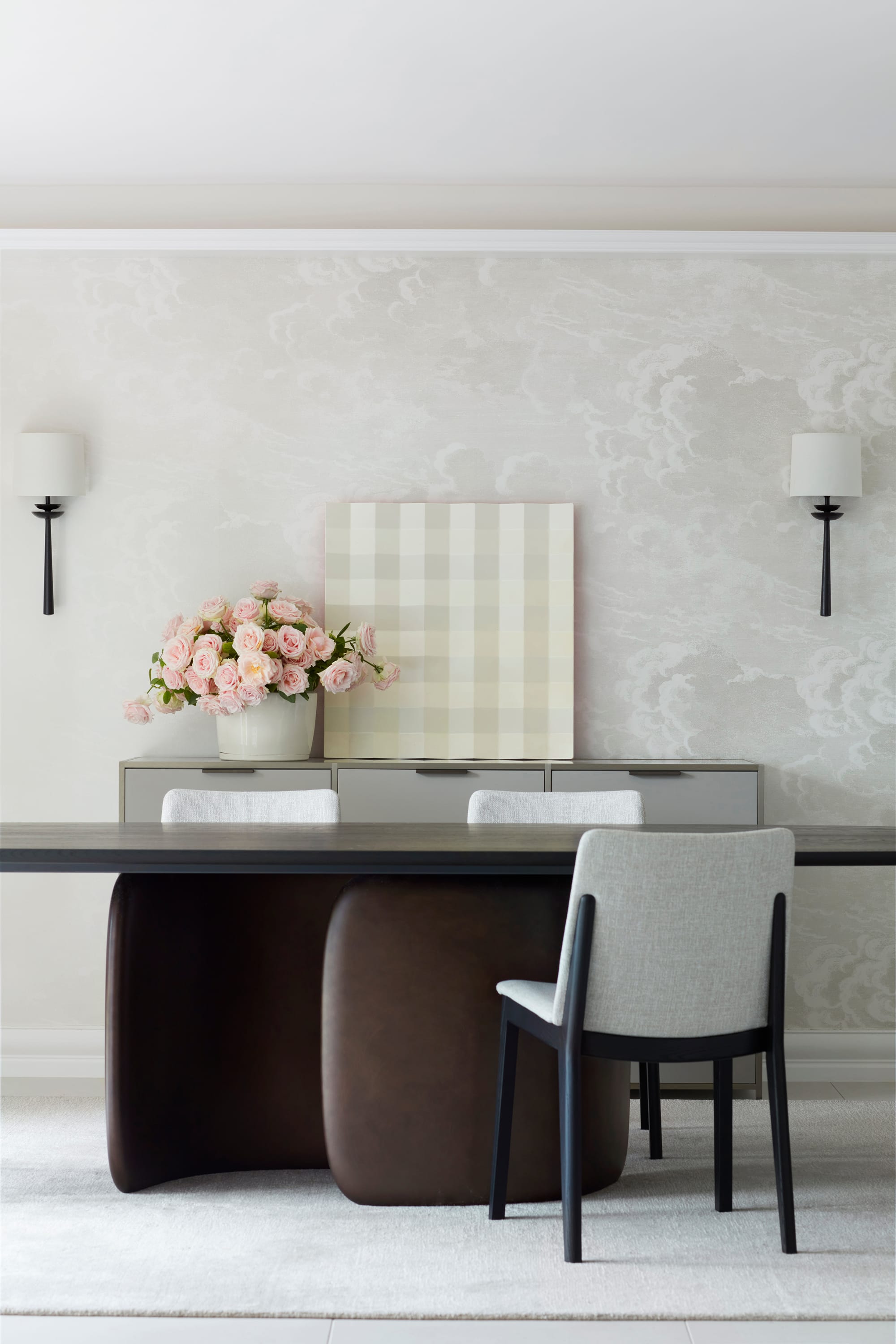 Marathon Road by Marylou Sobel Interior Design. Photography by Prue Ruscoe. Formal dining space with large table with sculptural timber legs, black tabletop, grey dining chairs and wall art in green gingham.