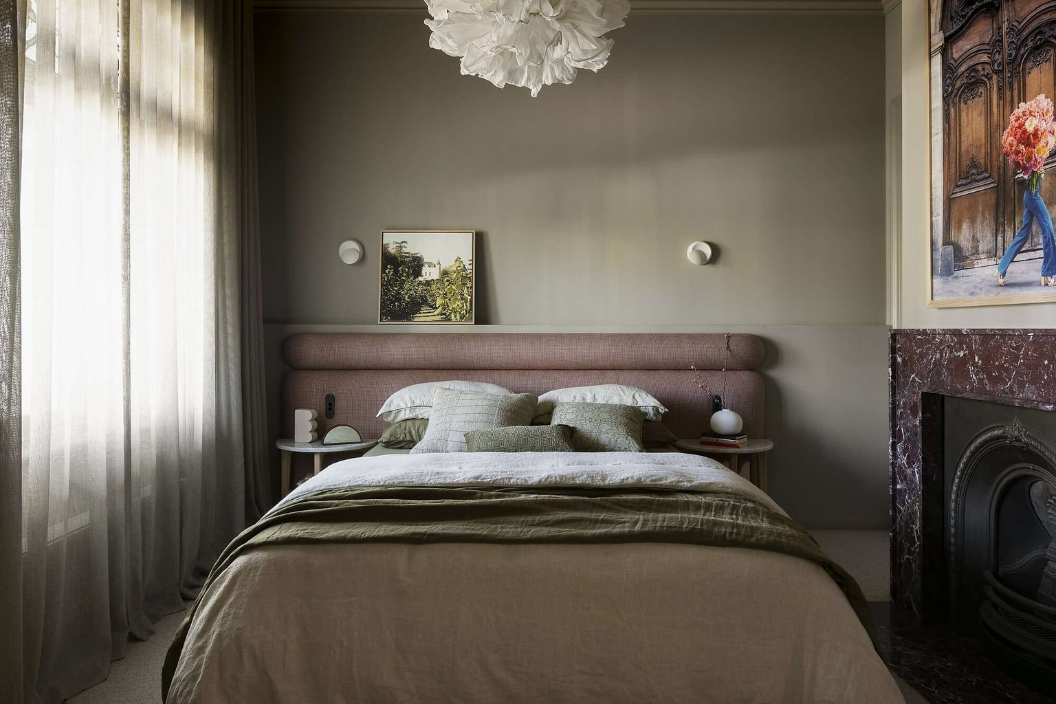 Albert Park Residence by FURNISHD. Photography by Dylan James. Bedroom with moss green walls, burgundy marble fireplace, maroon headboard and olive bedsheets. 