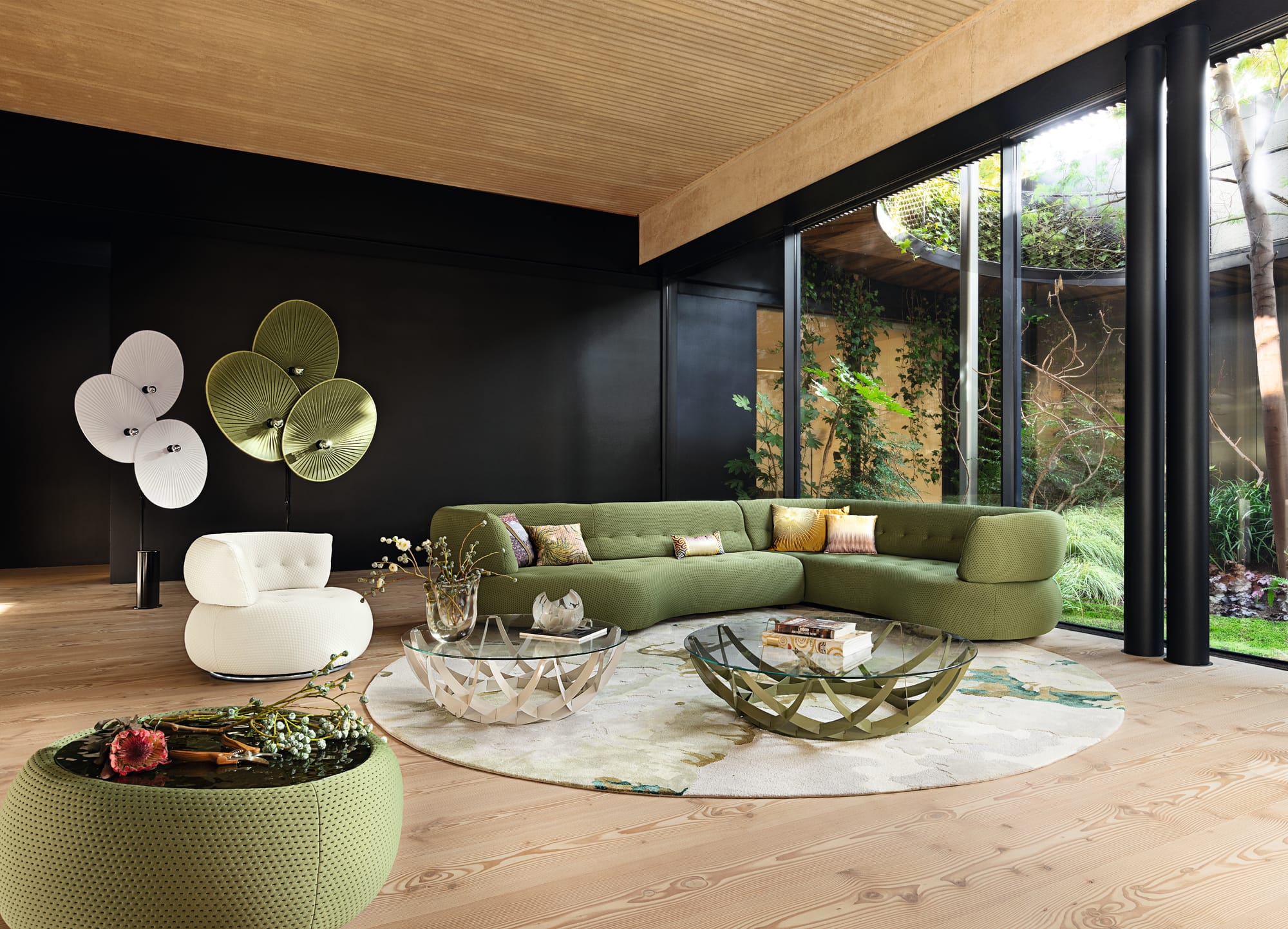 Bubble Collection by Roche Bobois. Image copyright of Roche Bobois. Red bubble couch with yellow and white coffee tables and matching bubble poufs.