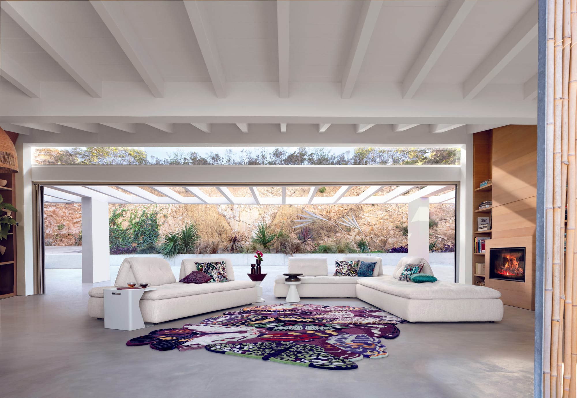 The Lounge Collection by Roche Bobois. Image copyright of Roche Bobois. Orange, pink, white and blue modular couch on white platform. 