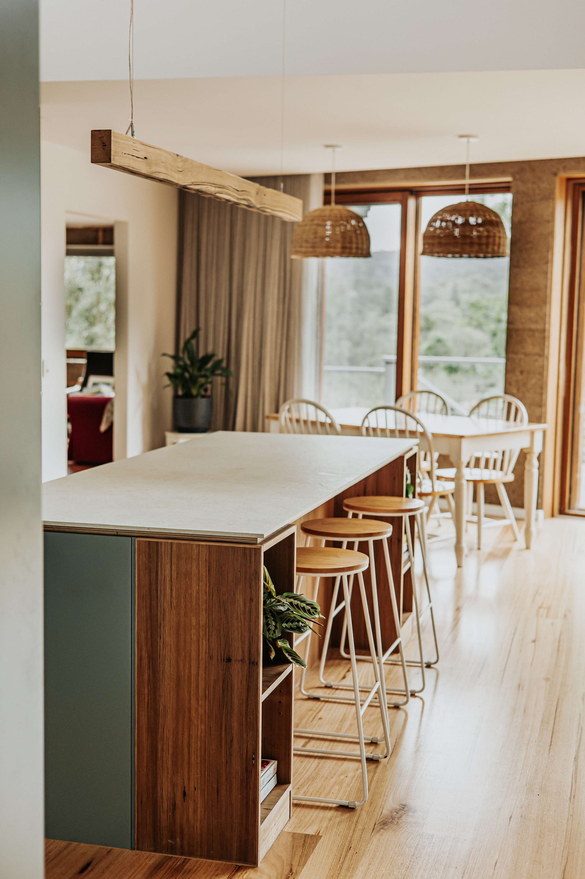 A detail shot of the island bench showing timber and green materials. 
