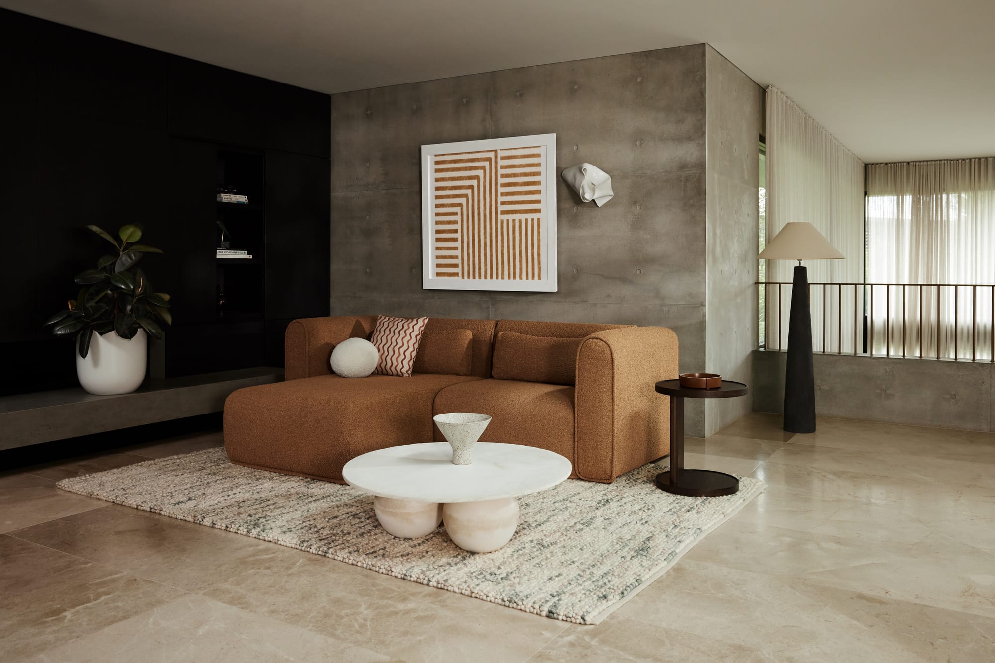 Koala's Bangalow Modular Sofa Bed in Sand Dune in a concrete interior.