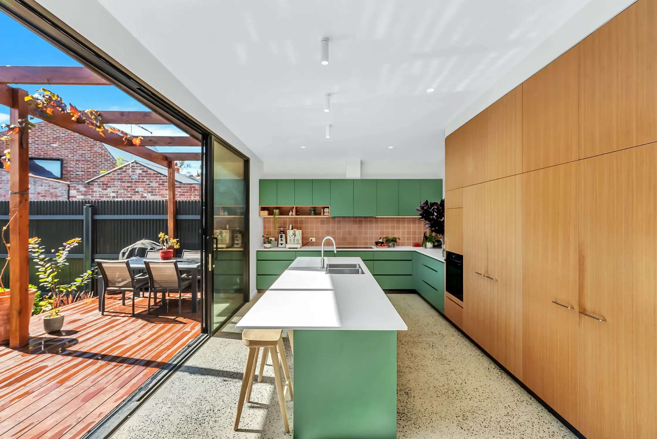 Natasha Slangen of Emotive Designs. Imagery copyright of Emotive Designs. Blonde woman with red cardigan and glasses. 