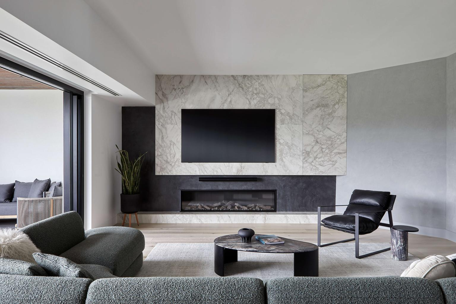 Andrew Samuels of Samuel Architecture. Man in navy shirt with arms crossed and neutral expression. 