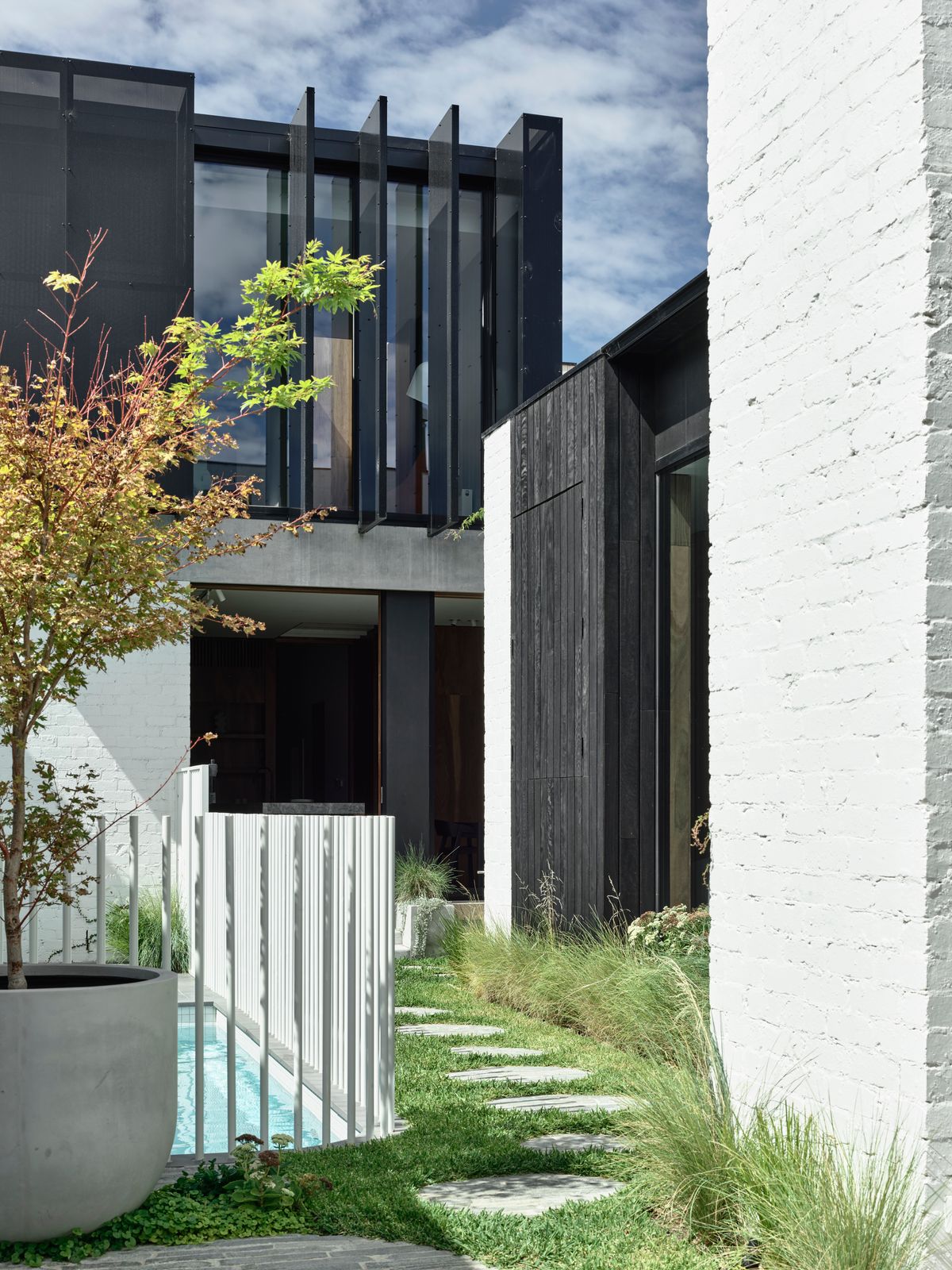 Carlton North Residence by Project 12 Architecture. Backyard view of new extension