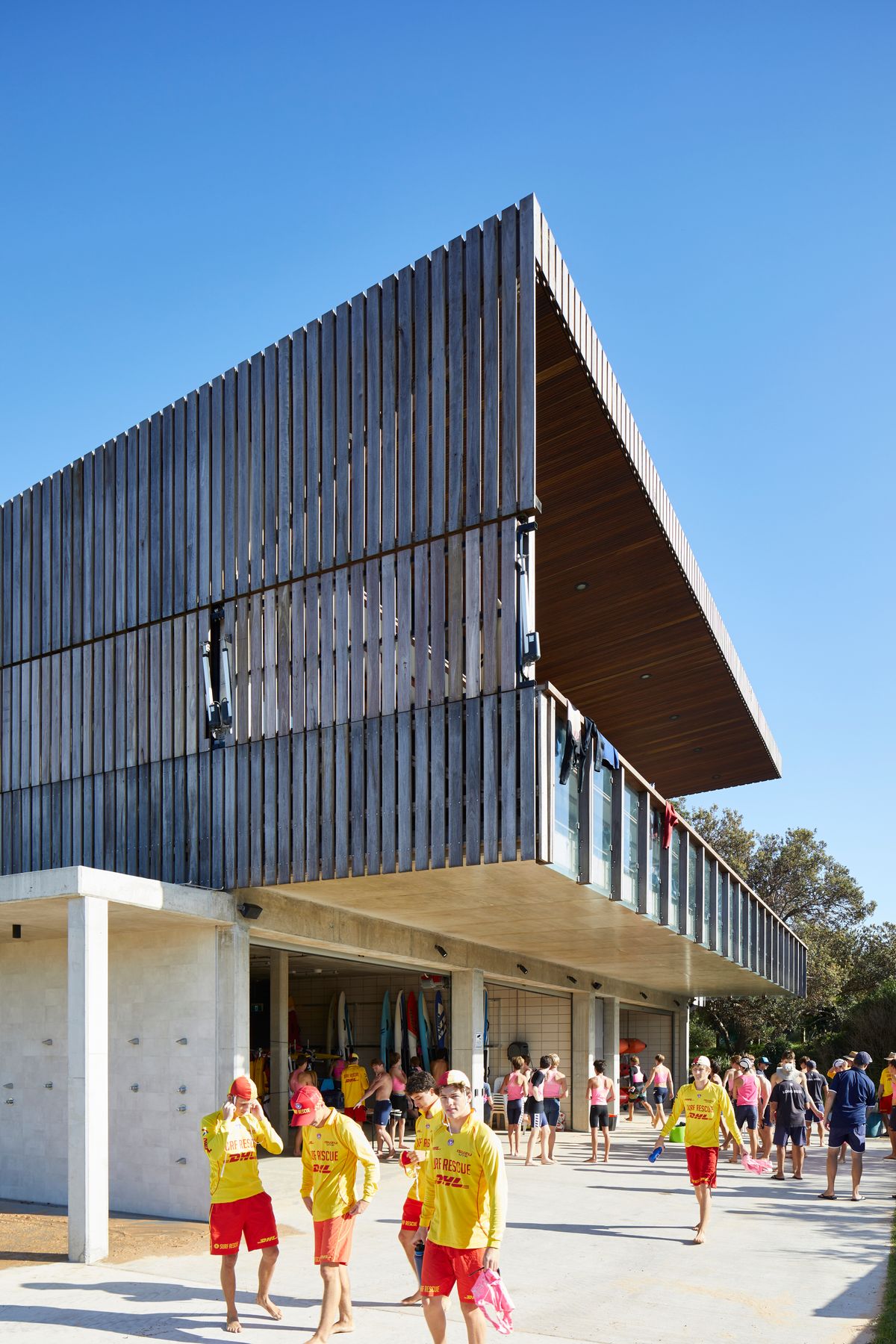 Long Reef SLSC by Adriano Pupilli Architects. Main SLSC club building featuring timber clad exterior 