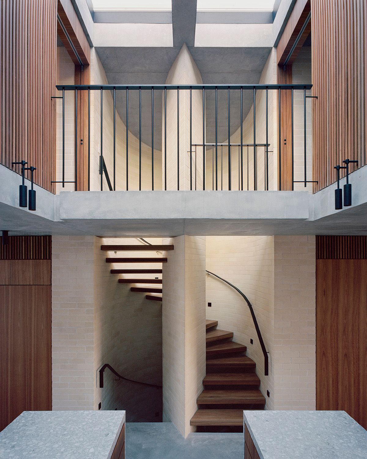 Bronte House by Tribe Studio Architects showing brick and timber feature stair