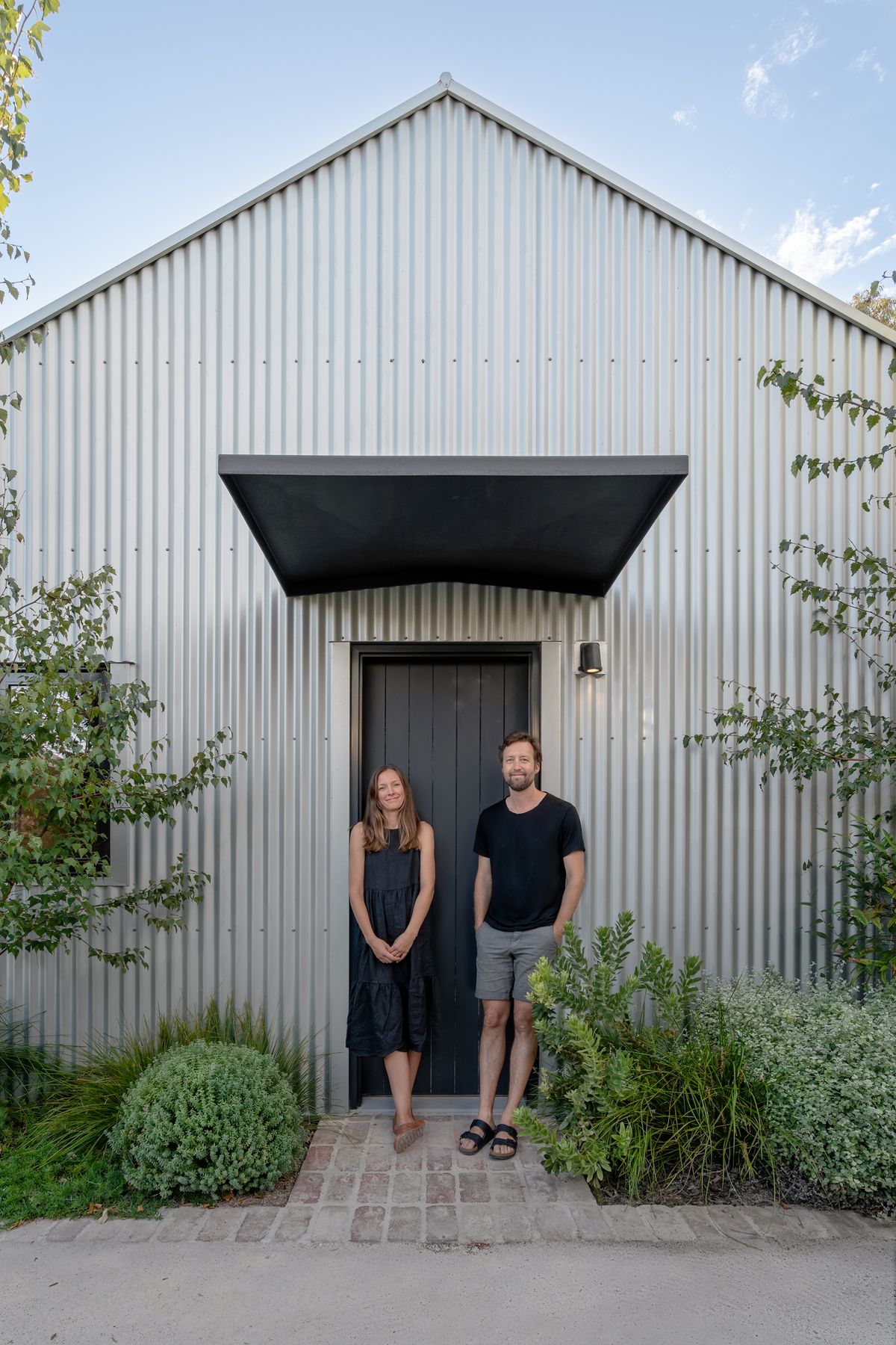 CO-founders and landscape architects Joel Barker and Hannah Pannell outside their new home