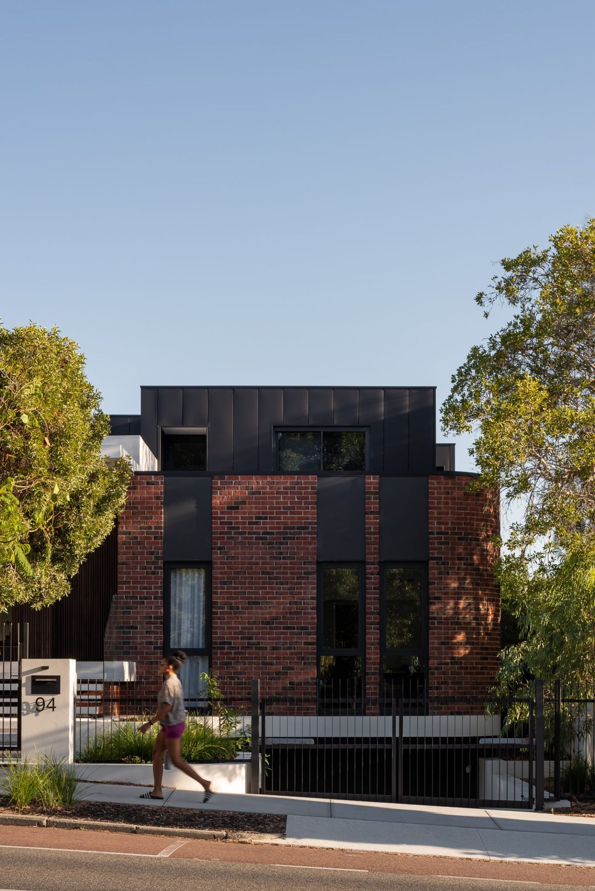 Hyde Park House by Robeson Architects. Modern multistory brick residential facade. 