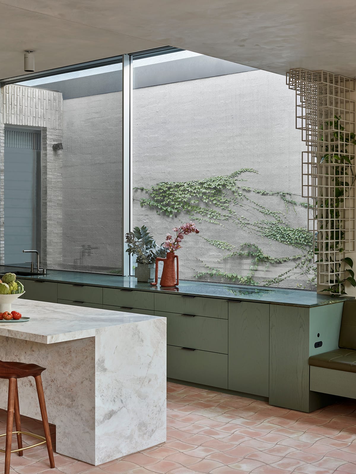 Terra Firma by RobsonRak. Photography by Mark Roper. Residential kitchen with terracotta floortiles, green counters and m