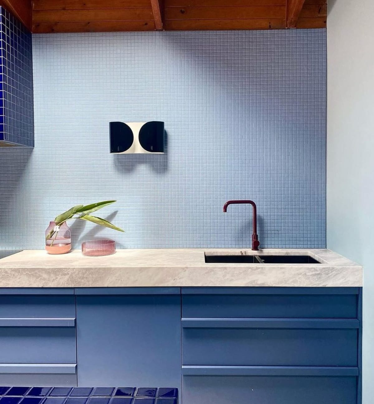 Par Tap mixer in a nicely styled kitchen with blue tiles, blue joinery and a white marble bench top