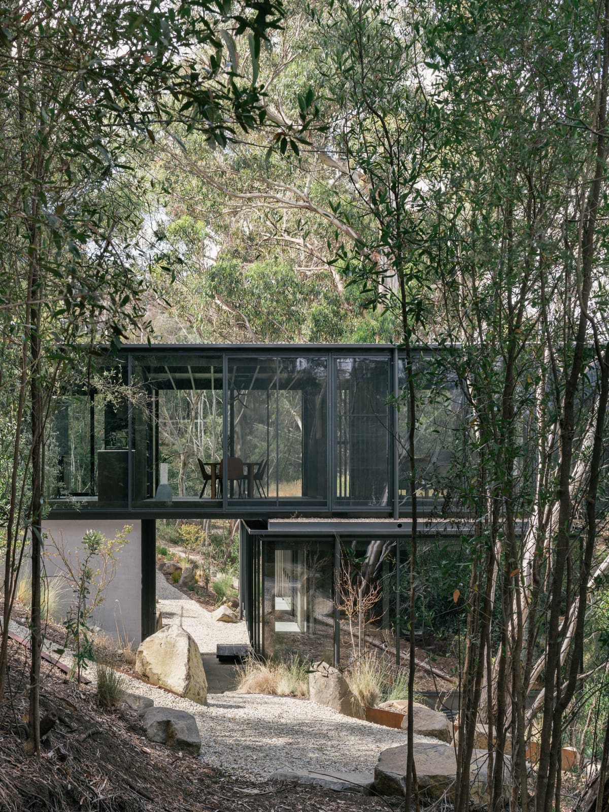 Taroona House by Archier. Photography by Thurston Empson. Double storey home with glass windows.